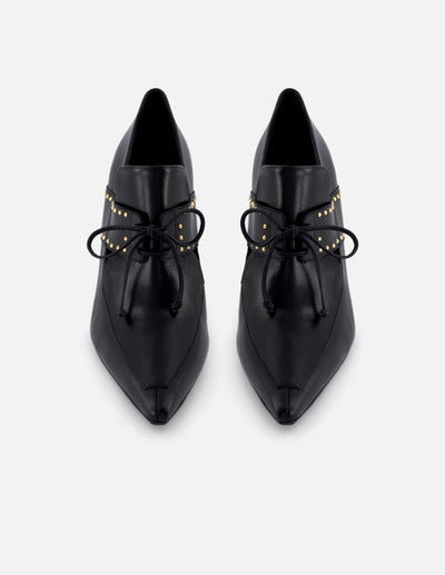 Zapatilla tipo mercedes de piel para mujer color negro con detalle de cordones