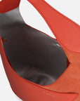 Bolso media luna piel ante y bombeada color coral