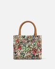 Bolso de mano en piel forrado con textil floral