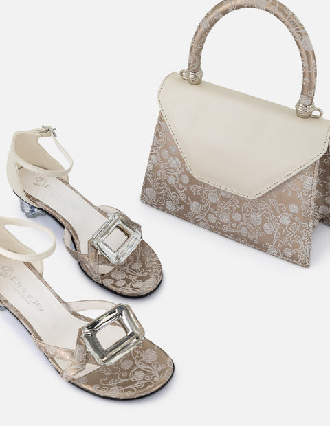 Satchel de piel  para mujer color dorado y acabados metalizados