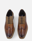 Zapato oxford cuero en piel picada con picado para hombre