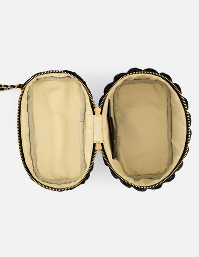 Minibolso negro vegano para mujer con diseño capitonado