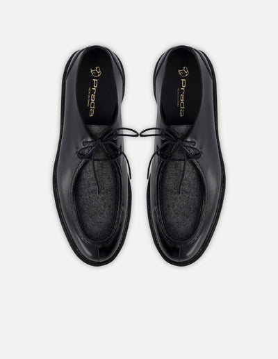 Wallabee en piel florantik y textil color negro con suela de goma para hombre.