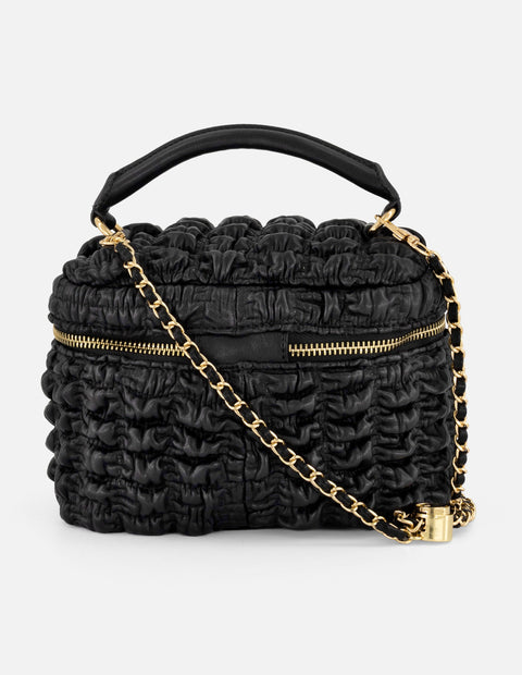 Minibolso negro vegano para mujer con diseño capitonado