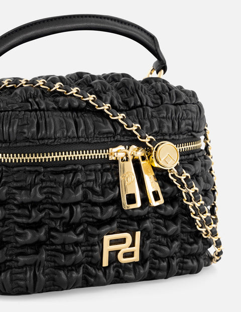 Minibolso negro vegano para mujer con diseño capitonado
