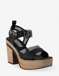 Sandalia en vinilo y piel de color negro para mujer