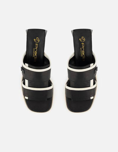 Mule de piel color negro para mujer con contraste en color blanco