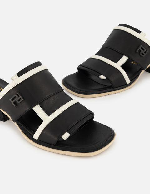 Mule de piel color negro para mujer con contraste en color blanco