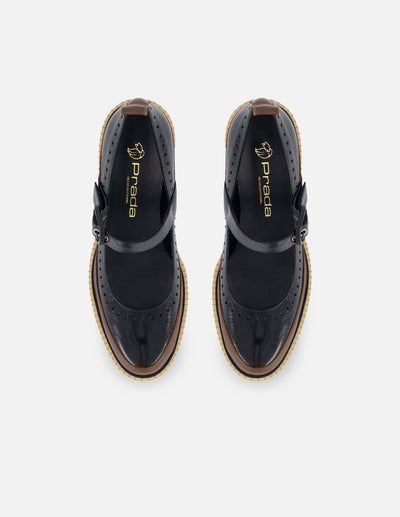 Zapatilla con pulsera tipo mercedes color negro para mujer con detalle bicolor