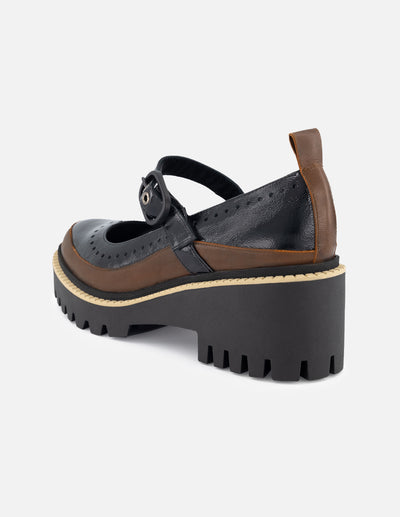 Zapatilla con pulsera tipo mercedes color negro para mujer con detalle bicolor