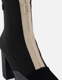 Botín de lycra color negro para mujer con cremallera y detalles de piel