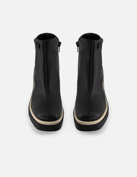 Botín de piel napa color negro para mujer con contraste blanco