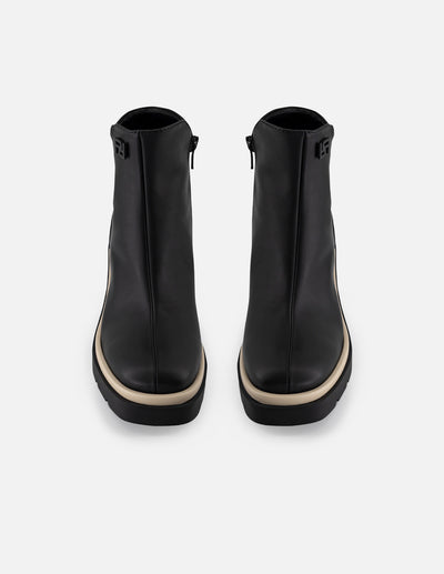 Botín de piel napa color negro para mujer con contraste blanco