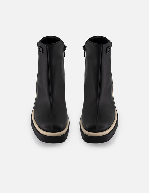 Botín de piel napa color negro para mujer con contraste blanco