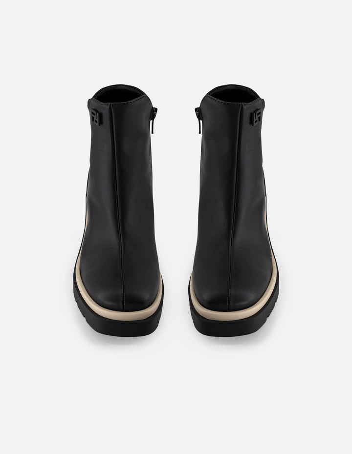 Botín de piel napa color negro para mujer con contraste blanco