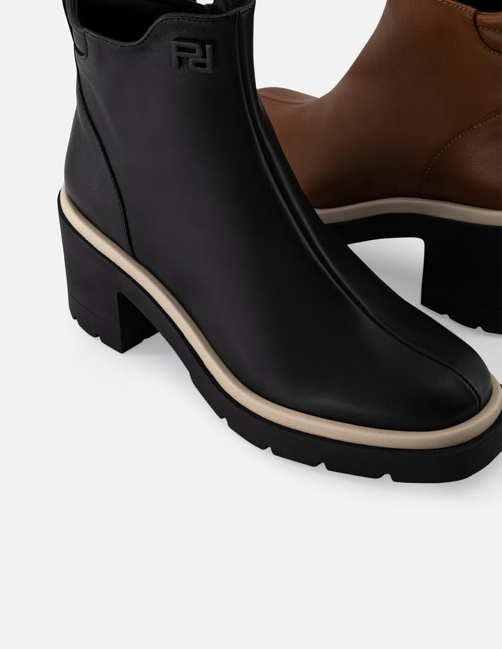 Botín de piel napa color negro para mujer con contraste blanco