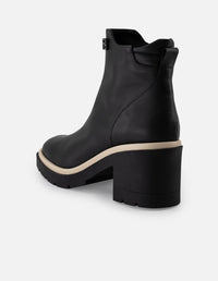 Botín de piel napa color negro para mujer con contraste blanco