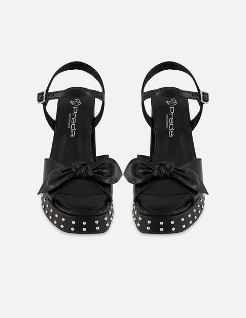 Sandalias negro piel para mujer con moño suave frontal