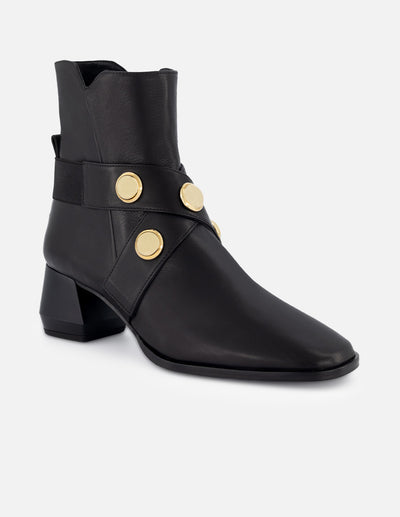 Botín de piel color negro para mujer con detalles color dorado