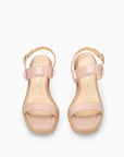 Sandalia tacón medio transparente en piel nude