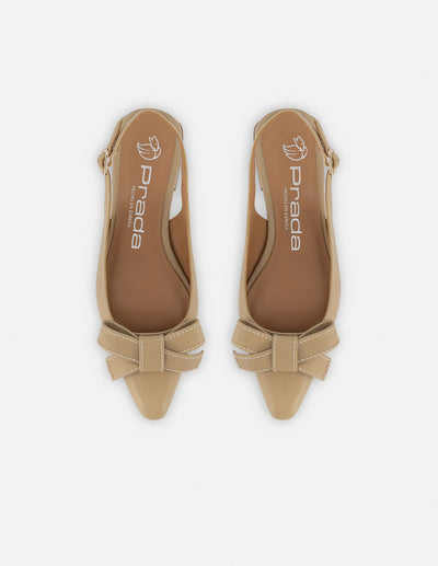 Zapatilla destalonada de piel para mujer color arena con moño decorativo al frente