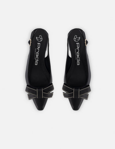 Zapatilla destalonada de piel para mujer color negro con moño decorativo al frente