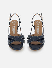 Sandalia destalonada de piel color marino para mujer con detalle de moño