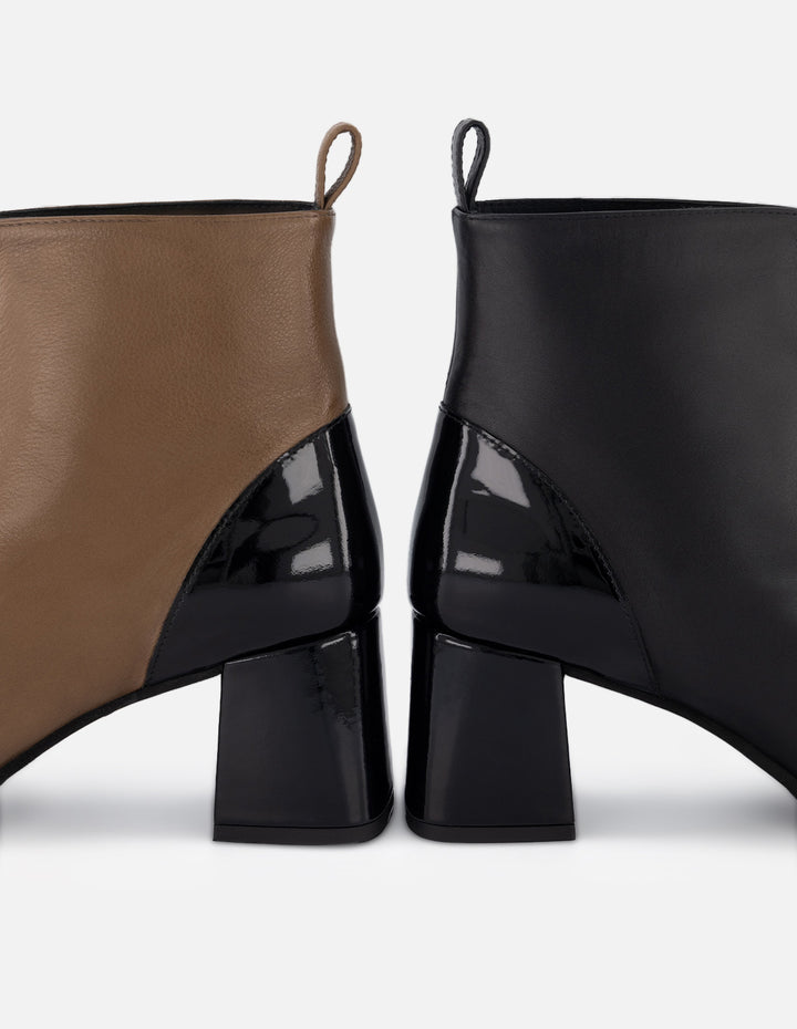 Botín de piel para mujer color negro y detalles en charol y cremallera frontal