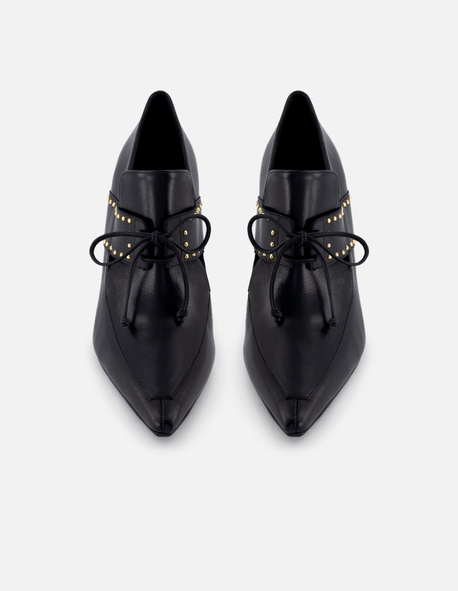 Zapatilla tipo mercedes de piel para mujer color negro con detalle de cordones