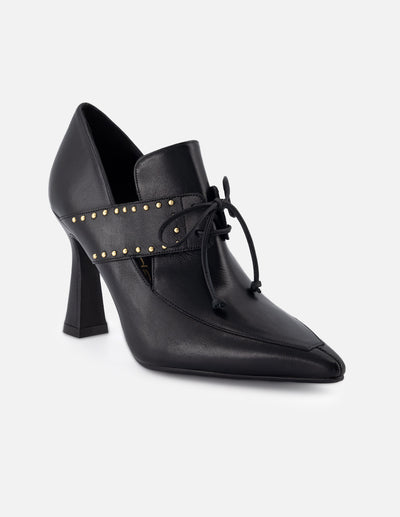 Zapatilla tipo mercedes de piel para mujer color negro con detalle de cordones