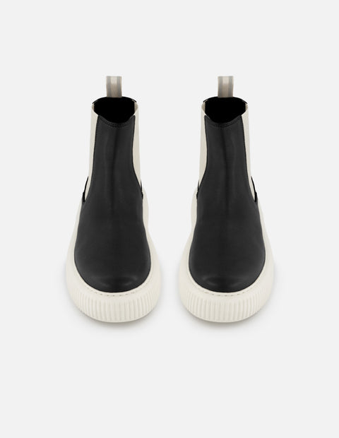 Botín chelsea de piel color negro para mujer con detalles en blanco
