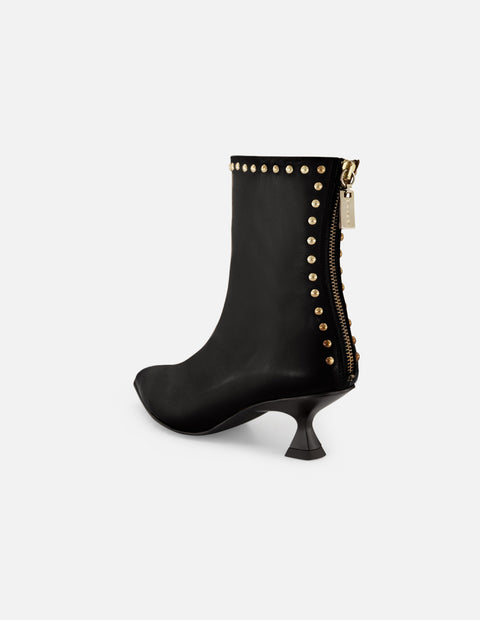 Botines negros piel de mujer adornos color dorado Pd