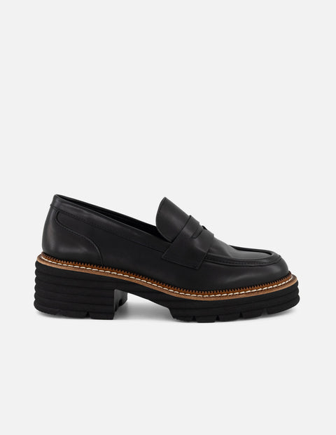 Mocasines negros con contraste café y suela ligera