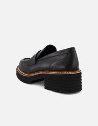 Mocasines negros con contraste café y suela ligera