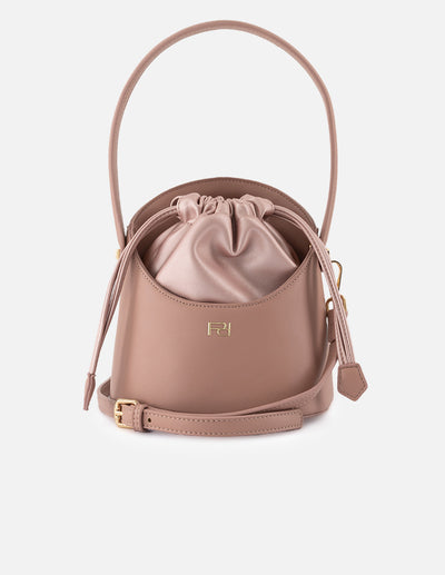 Bolso bucket de piel vegana para mujer color nude y detalles en piel