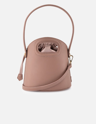 Bolso bucket de piel vegana para mujer color nude y detalles en piel