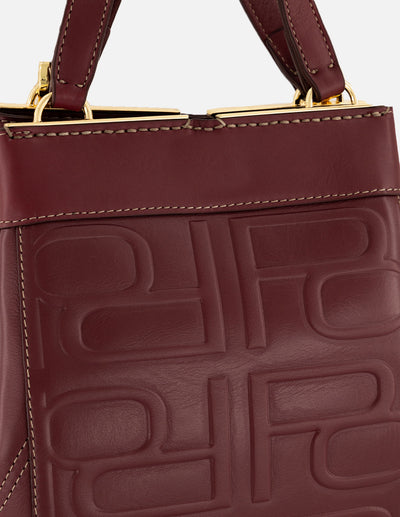 Bolso mano vino piel para mujer con relieve Pd