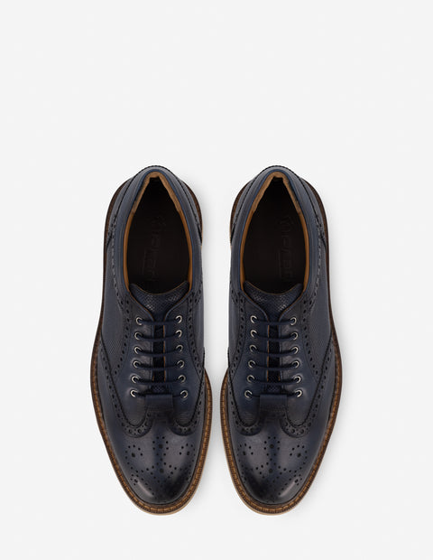 Oxford con calado en piel color azul para hombre
