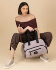 Bolso bowling de nylon color rosa unisex con detalle Pd