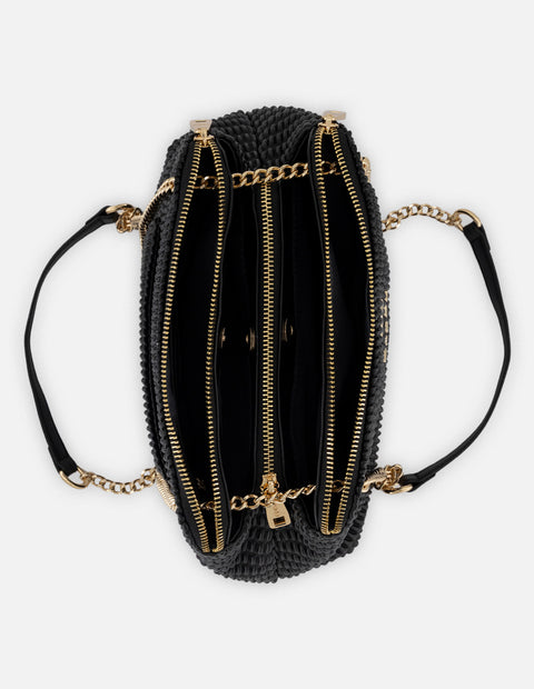 Bandolera negra piel vegana para mujer con capitonado