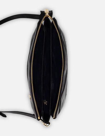 Bandolera negra en piel con costuras cruzadas para mujer