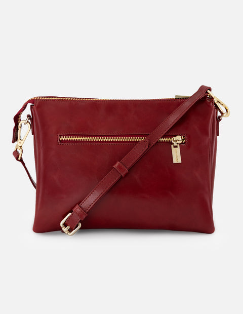 Bandolera roja en piel para mujer con costuras cruzadas
