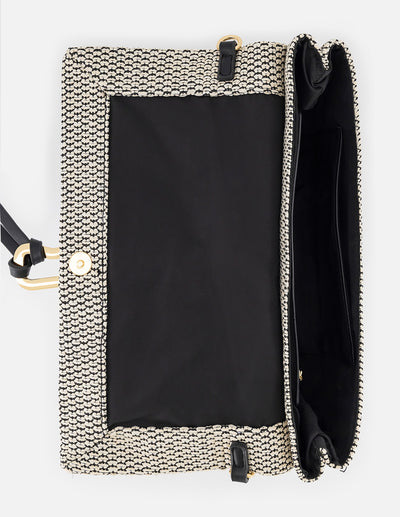 Clutch negro y blanco en rafia tejida con herraje decorativo para mujer