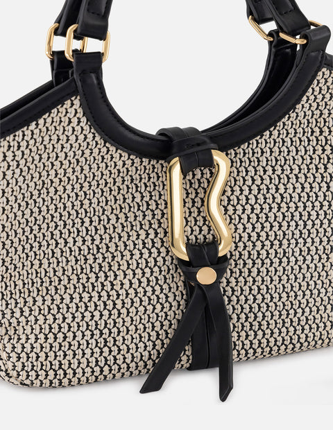Bolso de mano negro y blanco en rafia con aro metálico