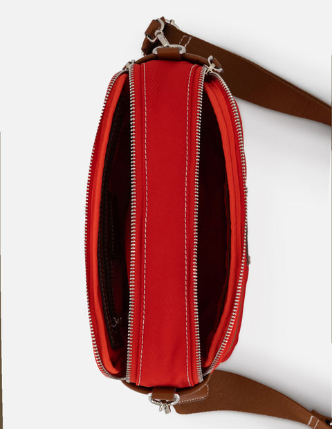 Bandolera roja en nylon con aplicaciones en contraste