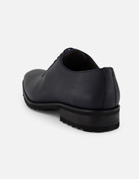 Zapato Oxford azul piel para hombre con corte asimétrico