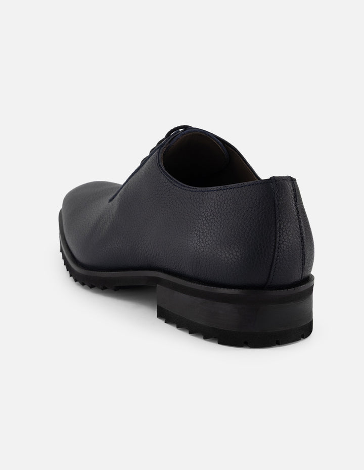Zapato Oxford azul piel para hombre con corte asimétrico