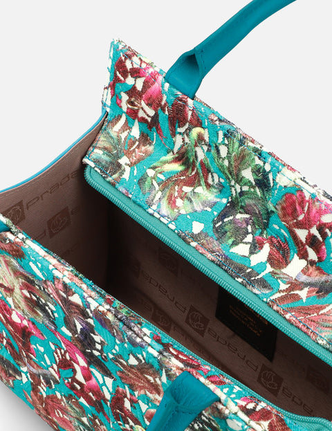 Bolso de mano en piel forrado con textil floral
