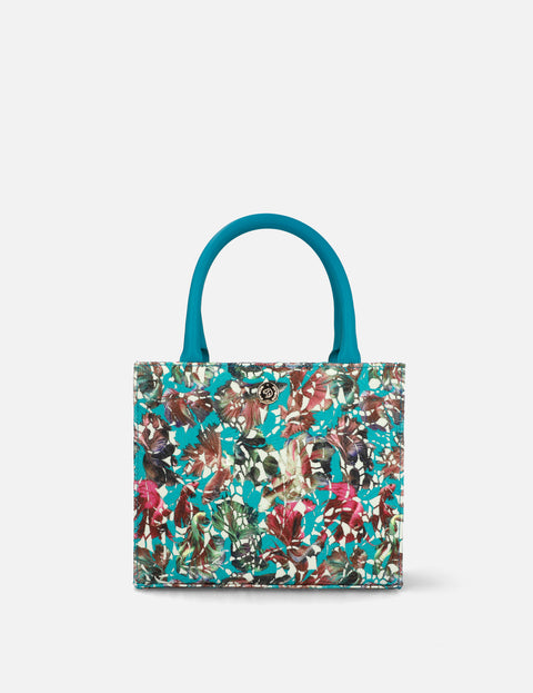 Bolso de mano en piel forrado con textil floral