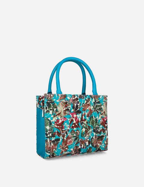 Bolso de mano en piel forrado con textil floral